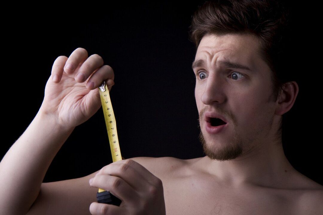 A man uses a soda compress to enlarge his penis